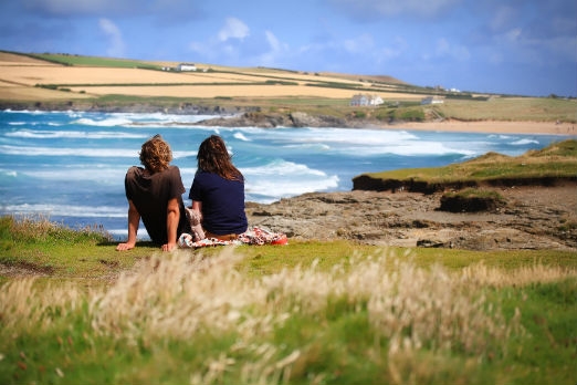Couple enjoying the beauty of the Cornish coast