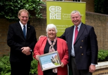 Julie Hepworth receives her Award from Sir Andrew Motion (left) and Charles Micklewright, Marsh Christian Trust